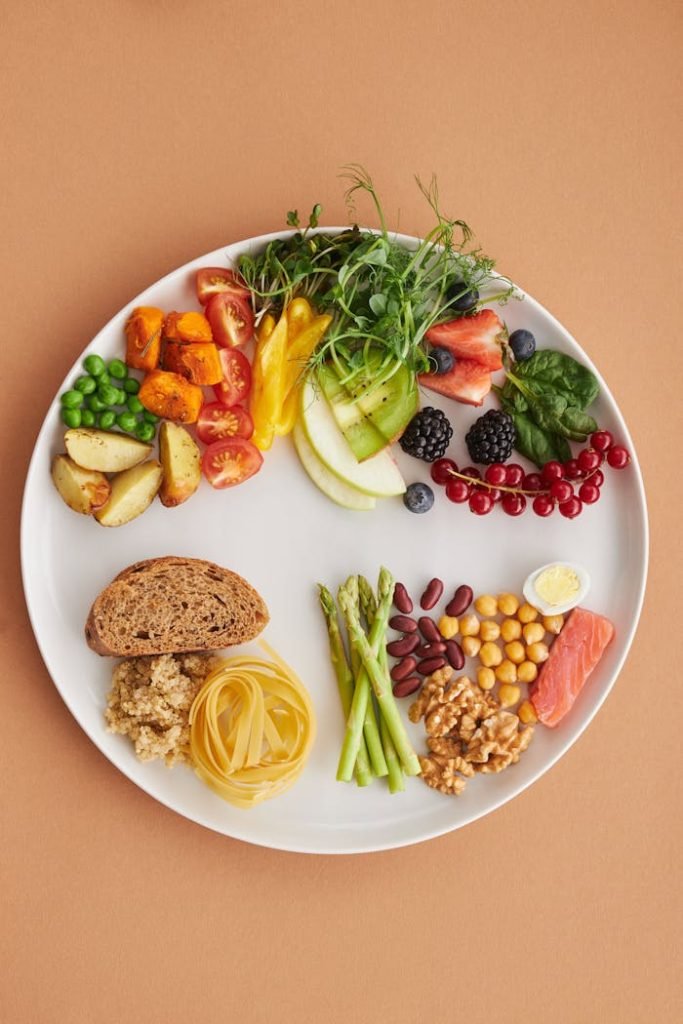 healthy-food-ingredients-on-a-ceramic-plate-5966432 Colorful assortment of healthy foods on a plate, perfect for a balanced diet.